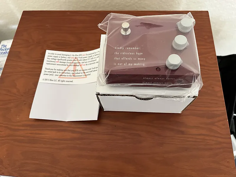 Mint condition items should be in their original packaging with manufacturer accessories included, like this Klon KTR pedal.